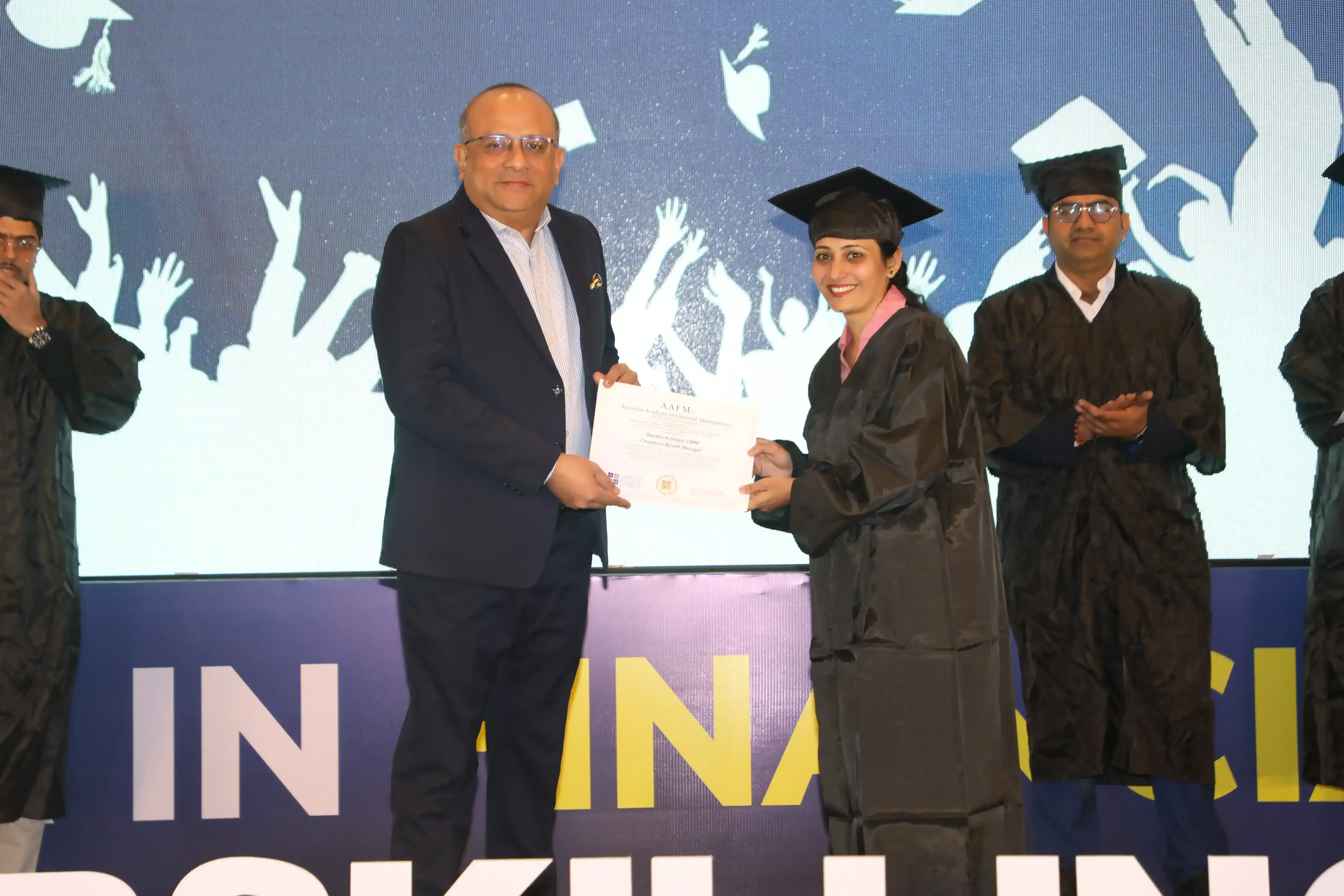 AAFM India convocation &mdash; graduate receiving certificate